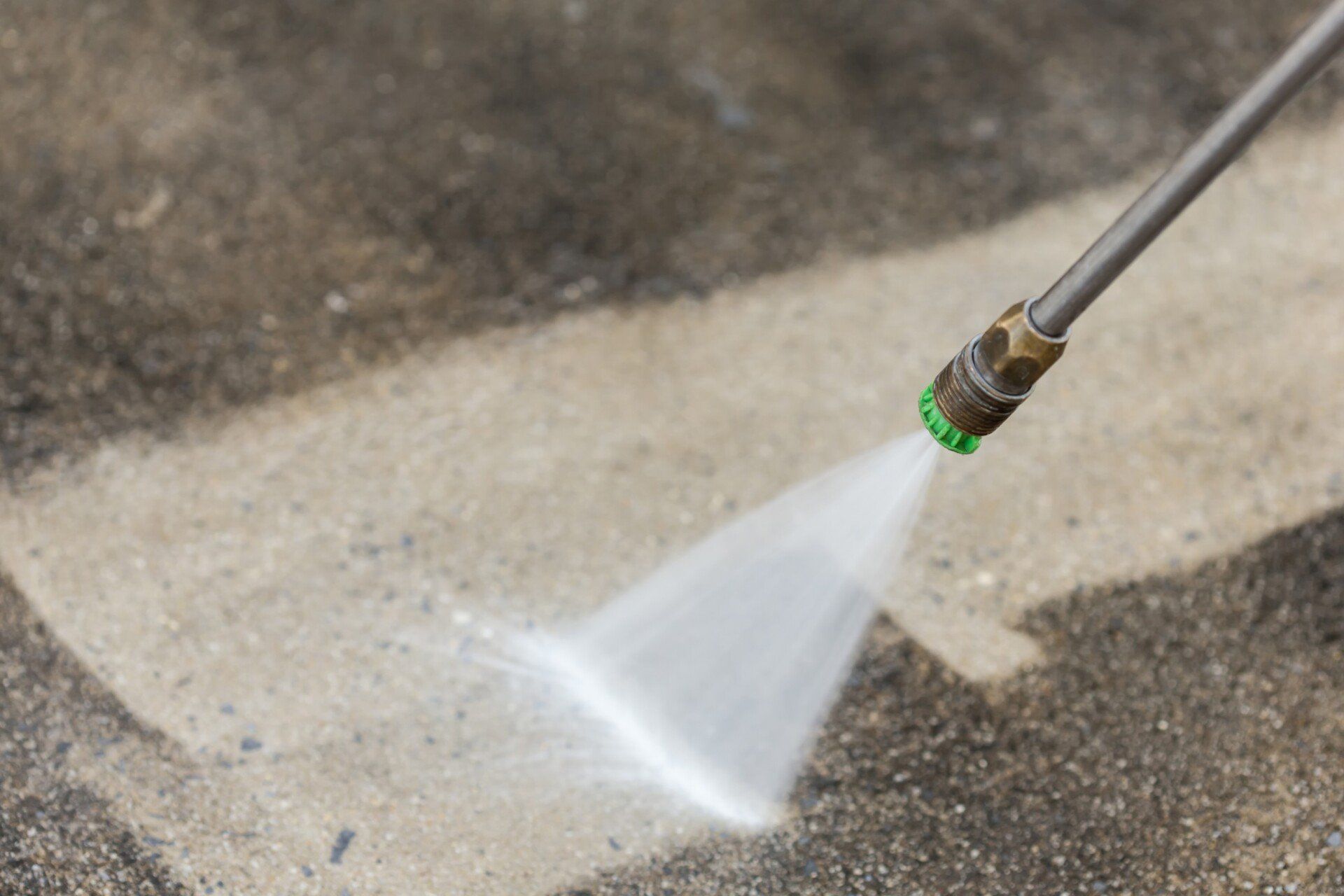 Fort Lauderdale Painters performing pressure washing in a commercial parking lot in Hollywood FL